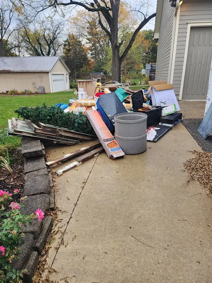 Dumpster being loaded with debris for Commercial Dumpster Rental in Glendale